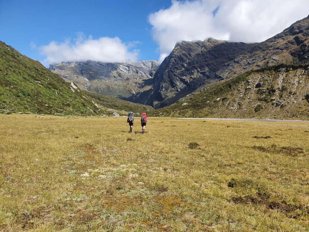 Walking+down+river+terraces+to+Horace+Walker+Hut.jpg