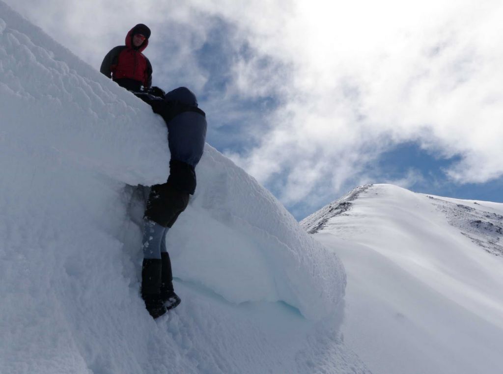 P9183902+Jeff+climbing+over+a+cornice.jpg